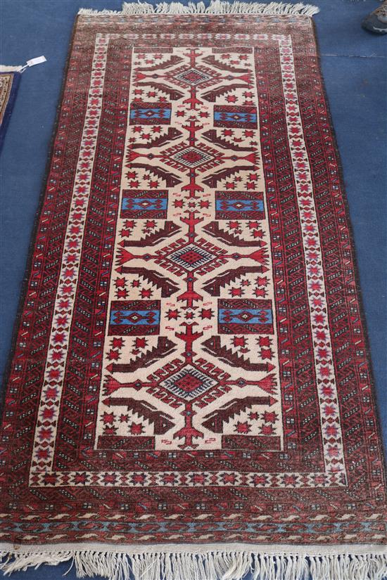 A Soumak cream and red ground rug, 190 x 96cm